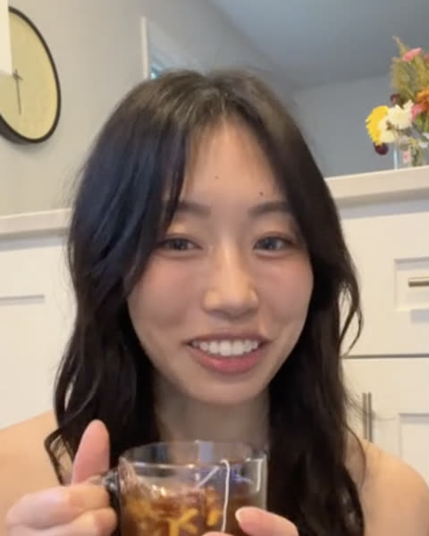 creator holding a cup of jujube tea